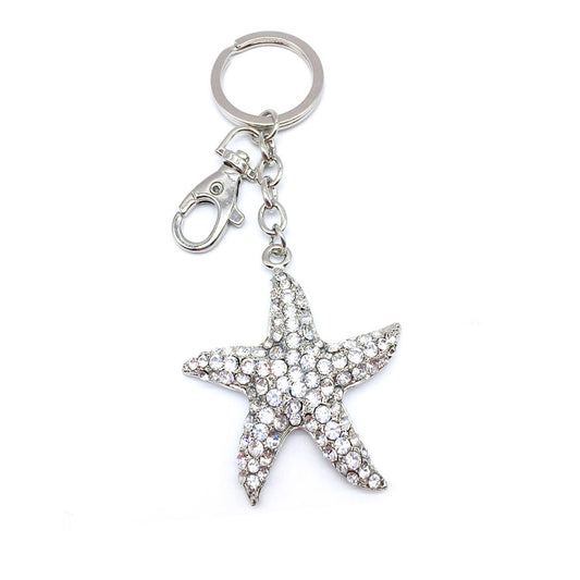 rhinestone dolphin, star, and gold fish keychain